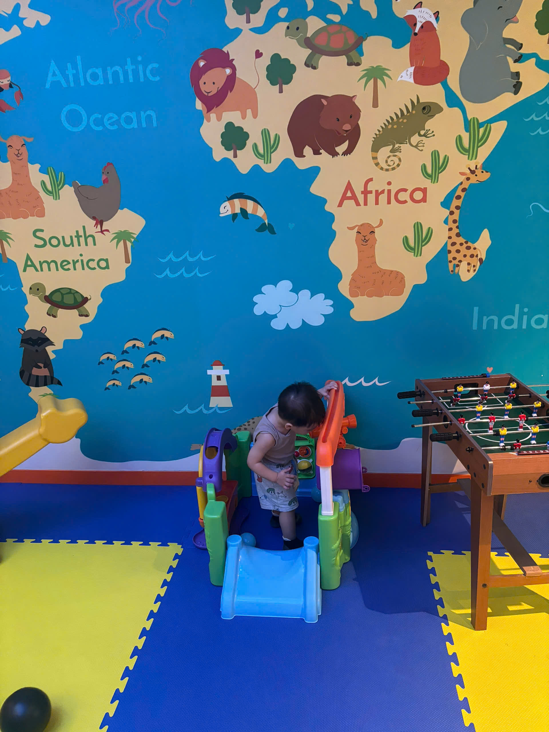 Happy family and children with English-speaking babysitter Anh Nguyen in Vietnam - A fun-filled day exploring the Giggle Beans Play Zone! Indoor playgrounds are perfect for building motor skills and making new friends in a safe environment. - Image 3
