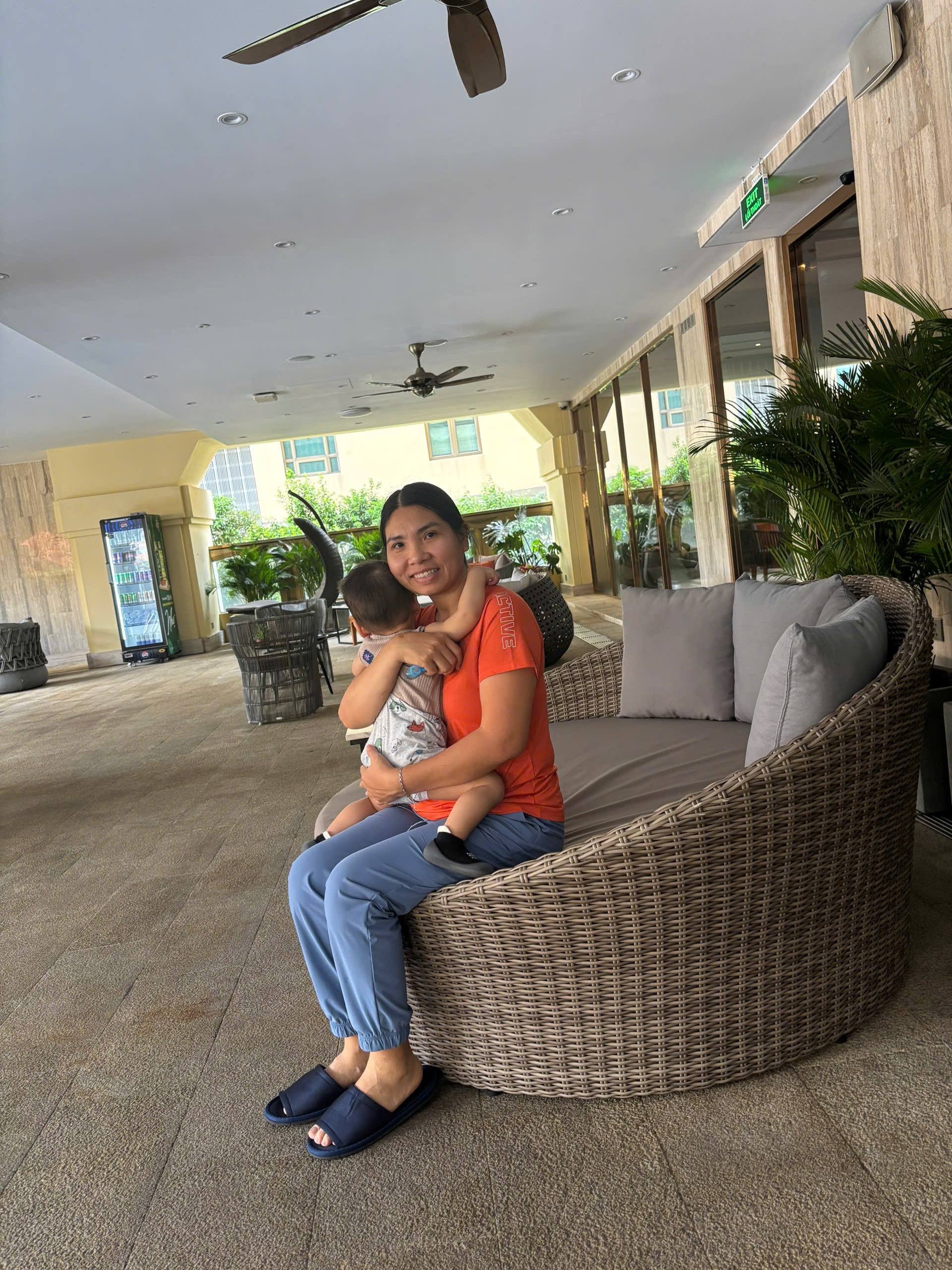 Happy family and children with English-speaking babysitter Anh Nguyen in Vietnam - Splashing around and having a great time at the swimming pool! A perfect way to cool down and have fun while practicing water safety. - Image 2